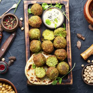 Falafel balls on a wooden cutting board.Arabic snack falafel